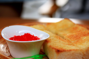 Toast bread and strawberry jam.