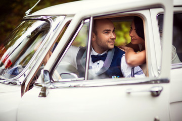 Wedding couple in car