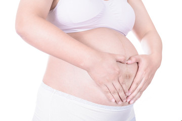 Loving couple with hands around pregnant belly