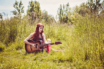 Girl plays the guitar