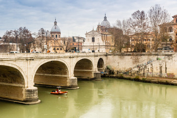 Bridge over the Tiber river in the center of Rome