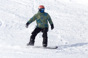 Fototapeta na wymiar snowboarder rides