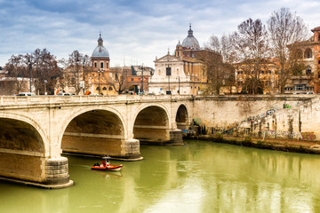 Bridge over the Tiber river in the center of Rome