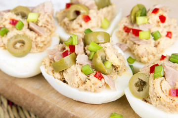 stuffed eggs with tuna, olives and paprica
