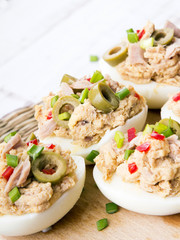 stuffed eggs with tuna, olives and paprica