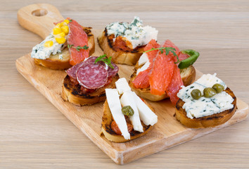 Tapas with cheese, salami and salmon