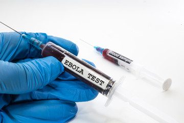Naklejka premium doctor with syringe with blood infected with ebola virus