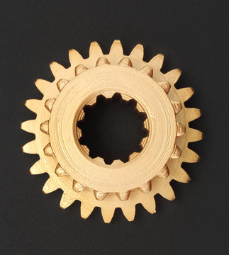 Copper and gold gear isolated on white background