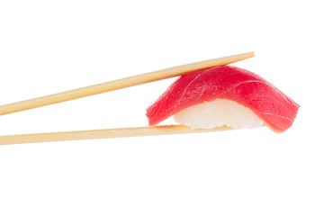 Sushi nigiri with chopsticks isolated on white