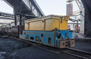 Train in national colors with trolleys in a coal mine. Donbass,