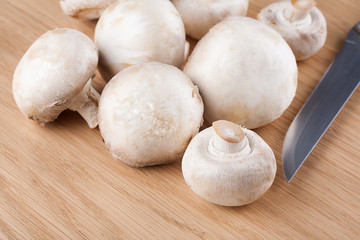 Fresh champignon mushrooms on the table
