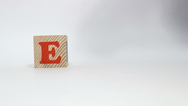 The video shows ego word built of wooden blocks