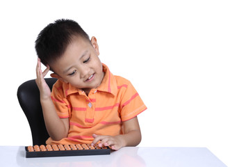 Little boy playing with abacus ,  isolated on white background