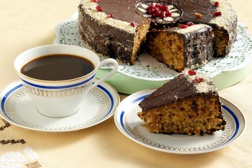 dates cake with chocolate icing and coffee
