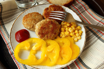 Homemade burgers with sweet peppers and corn