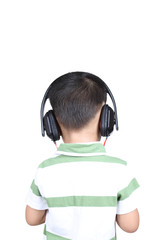 Back view kid listening to music on headphones, isolated on whit