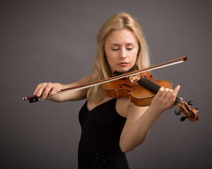Blond Female Violinist In Black Dress