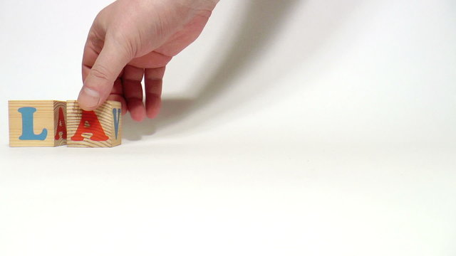 The video shows language word built of wooden blocks