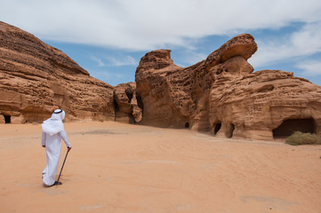 Saudian walking in Madaîn Saleh archeological site, Saudi Arabi