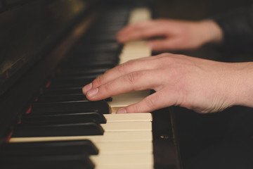 Hands playing piano close-up oldschool vintage instagram filter