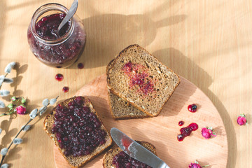 Fresh baked homemade healthy bread blackcurrant jam breakfast