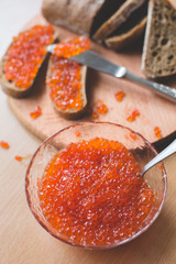 Red caviar toasts sandwich, red caviar bowl, homemade bread