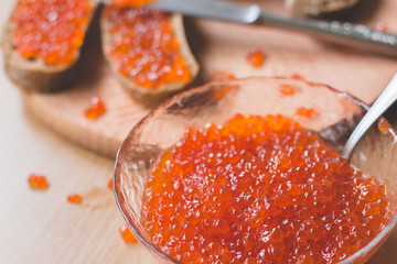 Red caviar toasts sandwich, red caviar bowl, homemade bread