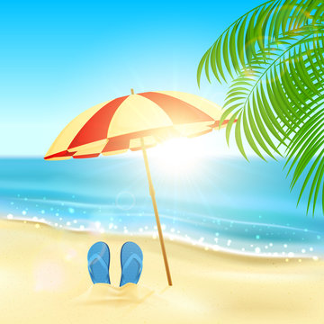 Flip flops and umbrella on the beach