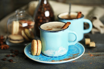 Beautiful composition with tasty cappuccino on wooden table