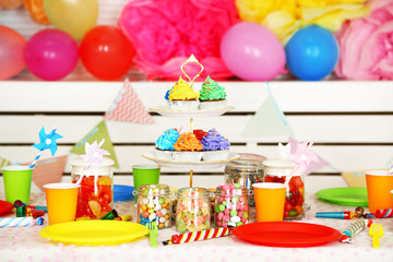 Fototapeta na wymiar Prepared birthday table with sweets for children party