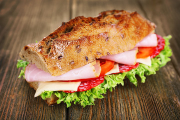 Fresh and tasty sandwich with ham and vegetables