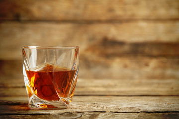 Whiskey on wooden background