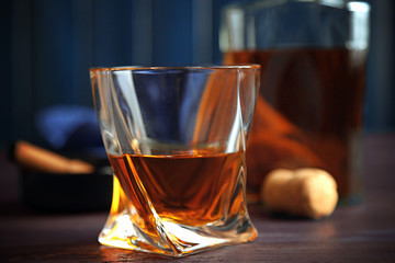Whiskey on wooden background