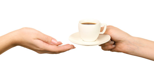 Female hands holding cup of coffee with saucer isolated on white