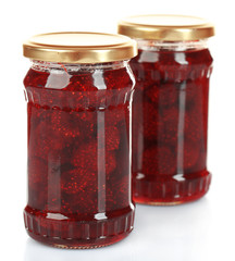 Jars of strawberry jam isolated on white