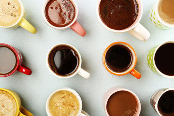 Many cups of coffee on table, top view
