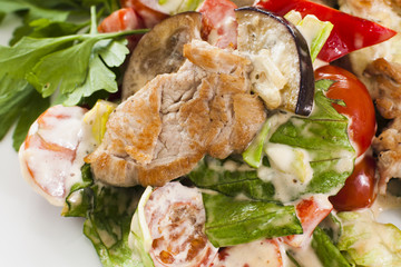 Meat with vegetables and herbs.