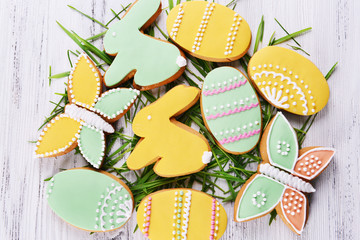 Delicious Easter cookies on wooden background