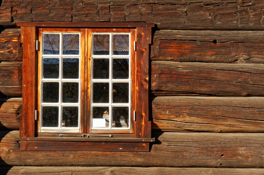 Norwegian wall of logs with window