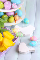 Easter decoration, eggs and tulips on table close-up