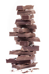 Stack of dark chocolate, isolated on white background