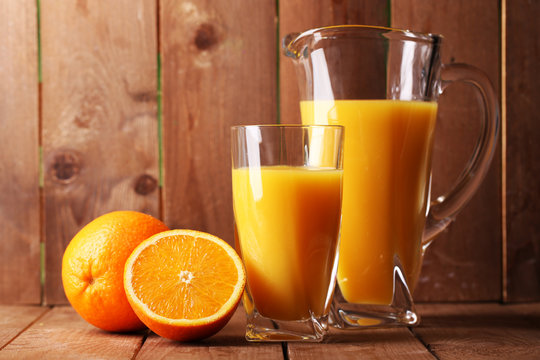 Glass and pitcher of orange juice
