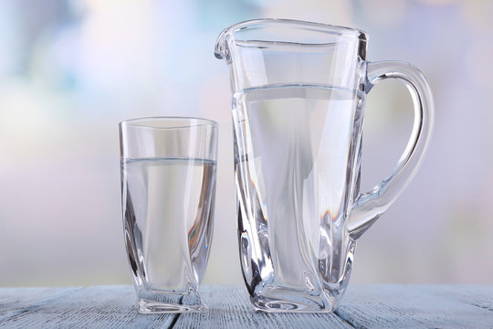 Glass pitcher and glass of water