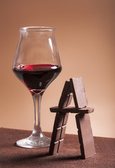 Red wine glass and chocolate pyramid
