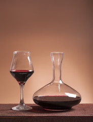 Red wine glass and filled decanter