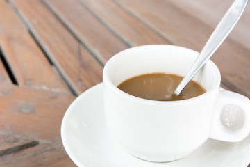 cup of coffee on wooden table