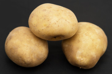 potatoes on a black background