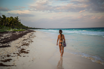 Young Girl Walking beaches of Tulum. Caribbean Paradise,