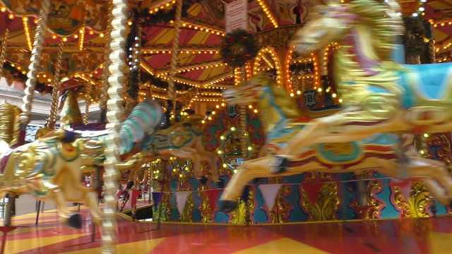 Old vintage carousel spinning