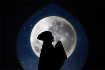Card design silhouette of muslimah pray on blue moon